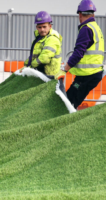 SIS Pitches staff resurfacing a 3g football pitch